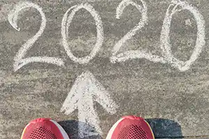 year 2020 written in chalk on the ground